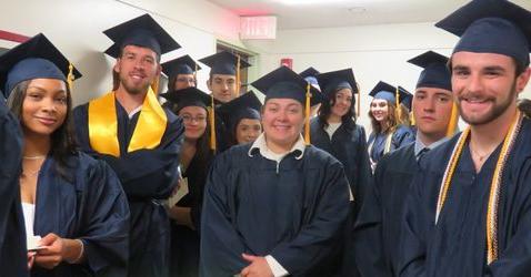 a picture of commencement-participants waiting to graduate